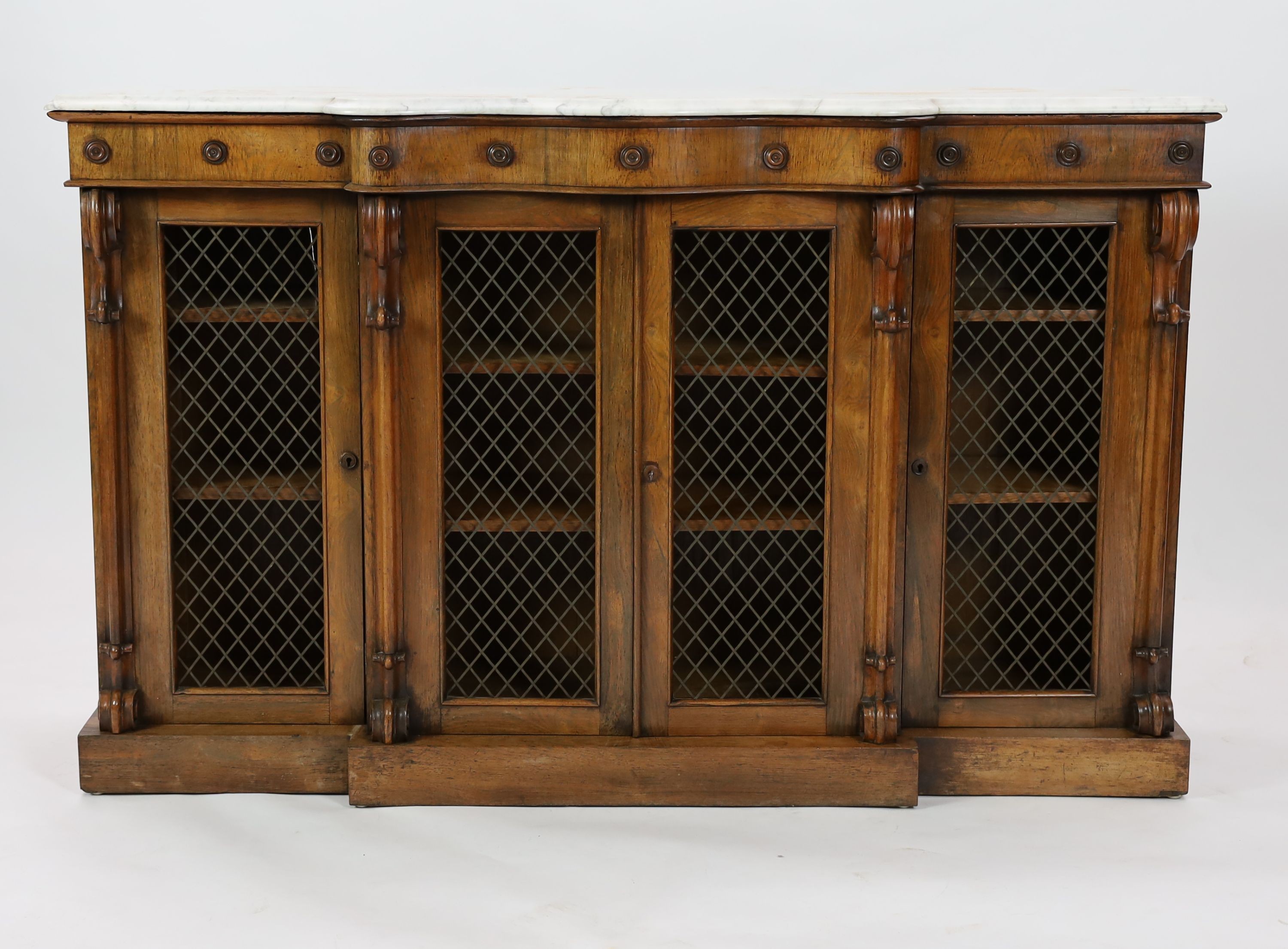 A Victorian rosewood serpentine dwarf bookcase, W.154cm D.44cm H.97cm